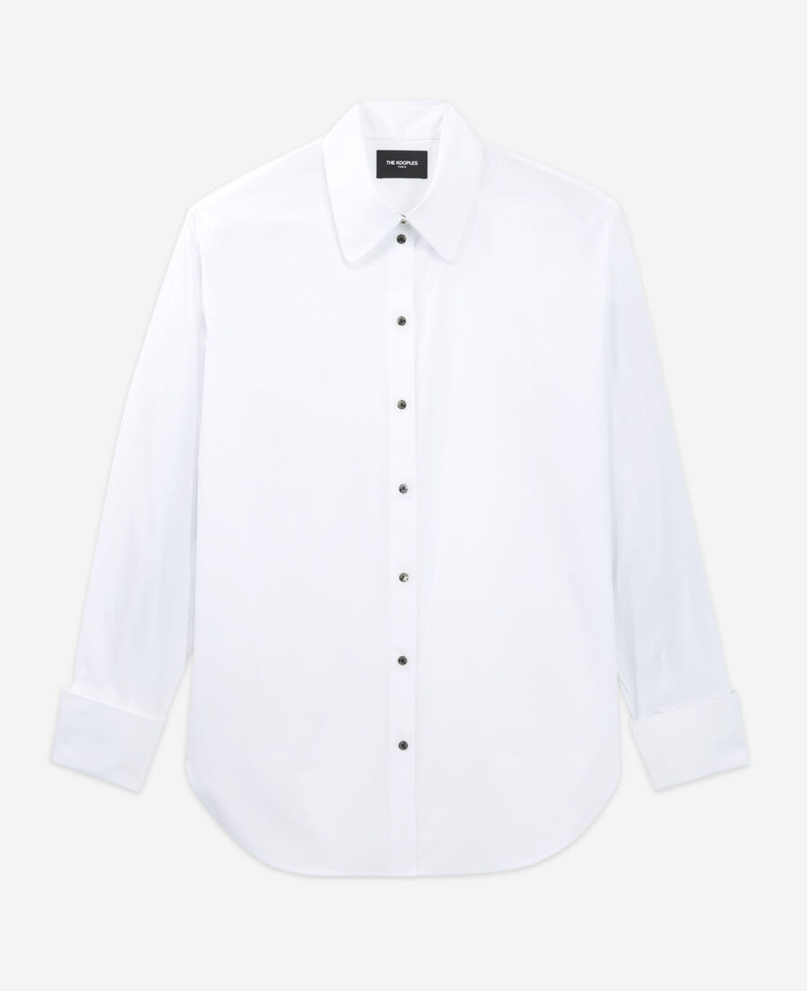 loose white shirt with press stud fastening
