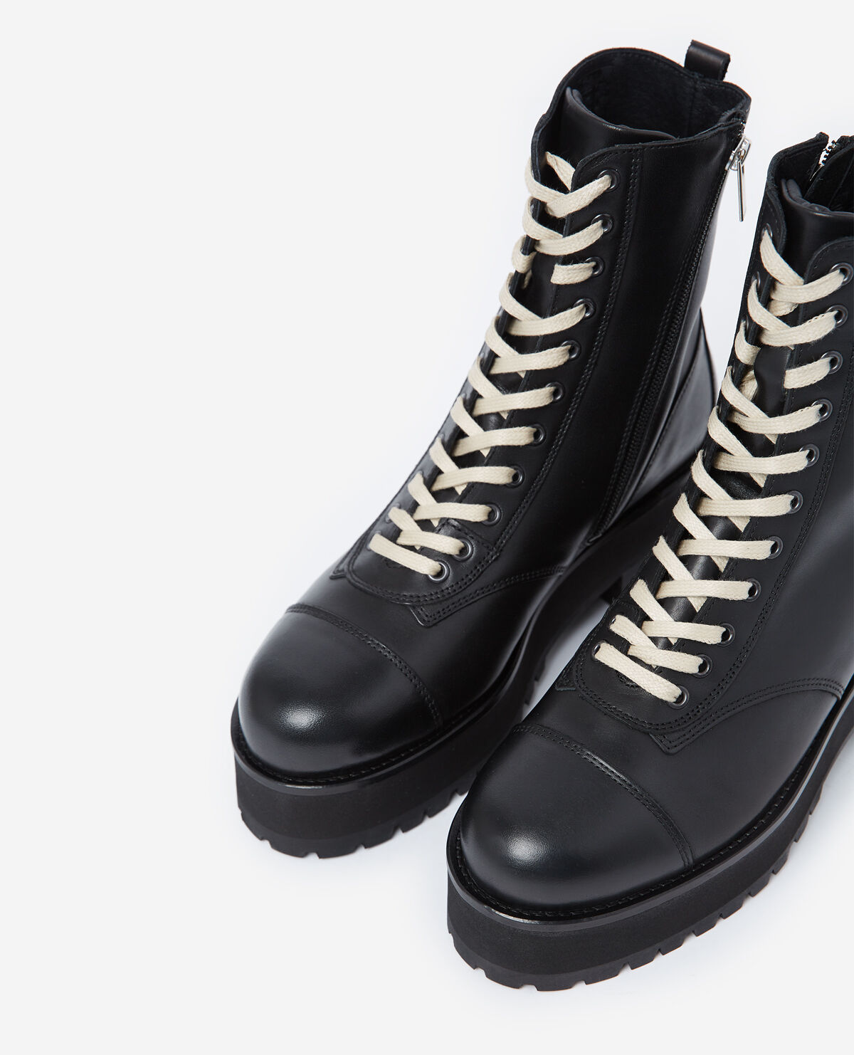 Black leather ankle boots with notched soles
