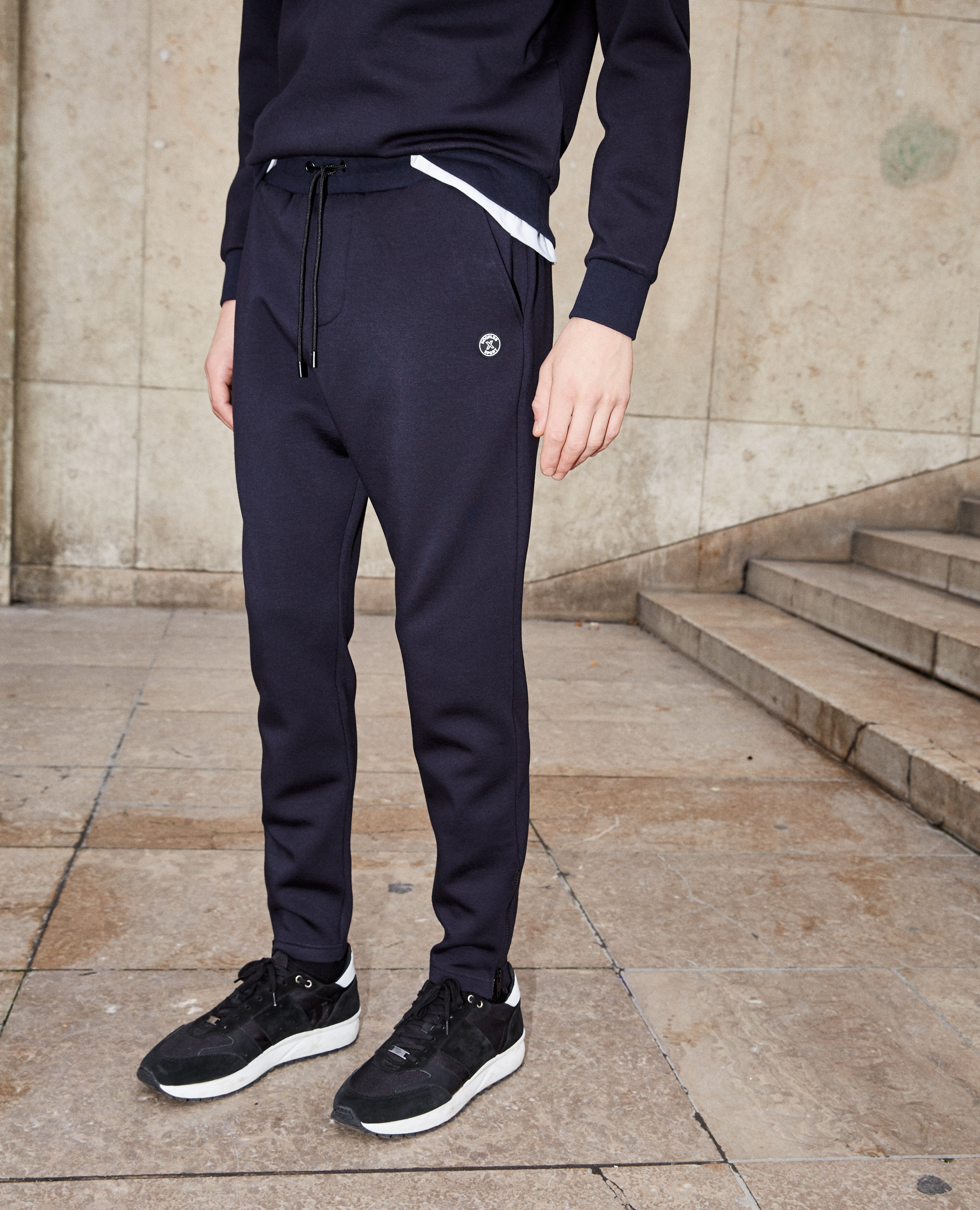 Fitted blue joggers with zips