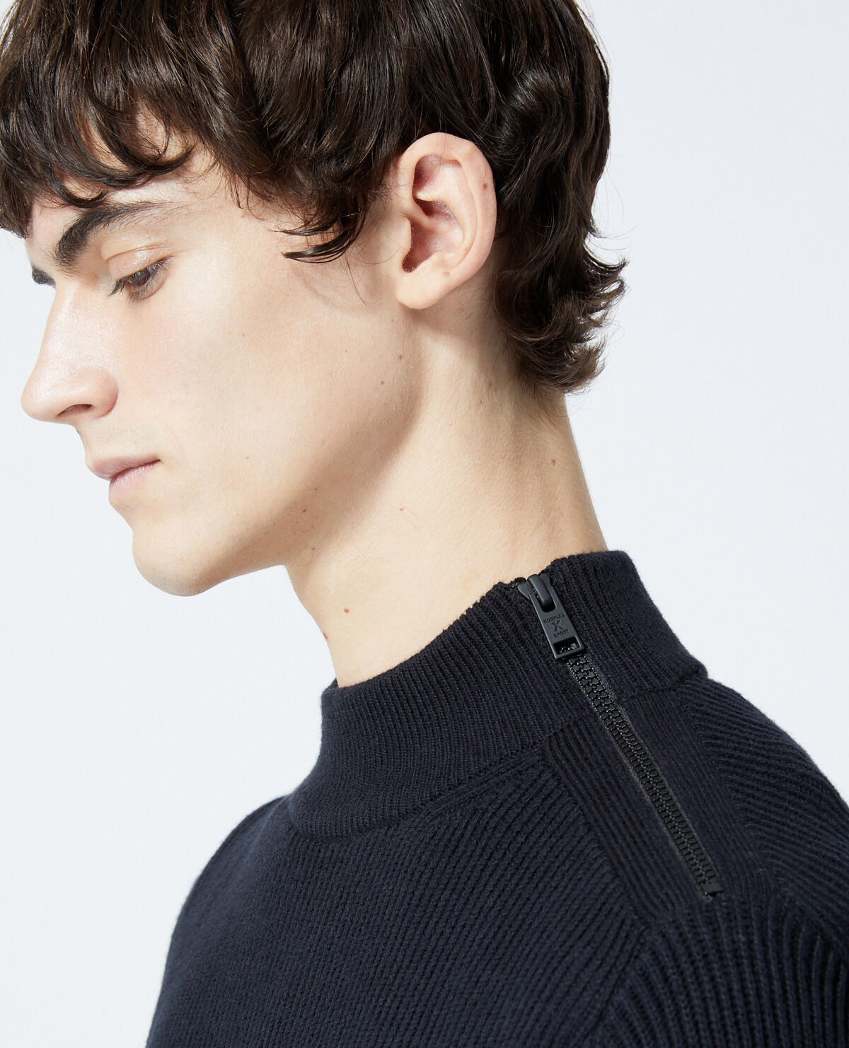 Black wool sweater with zipped high neck