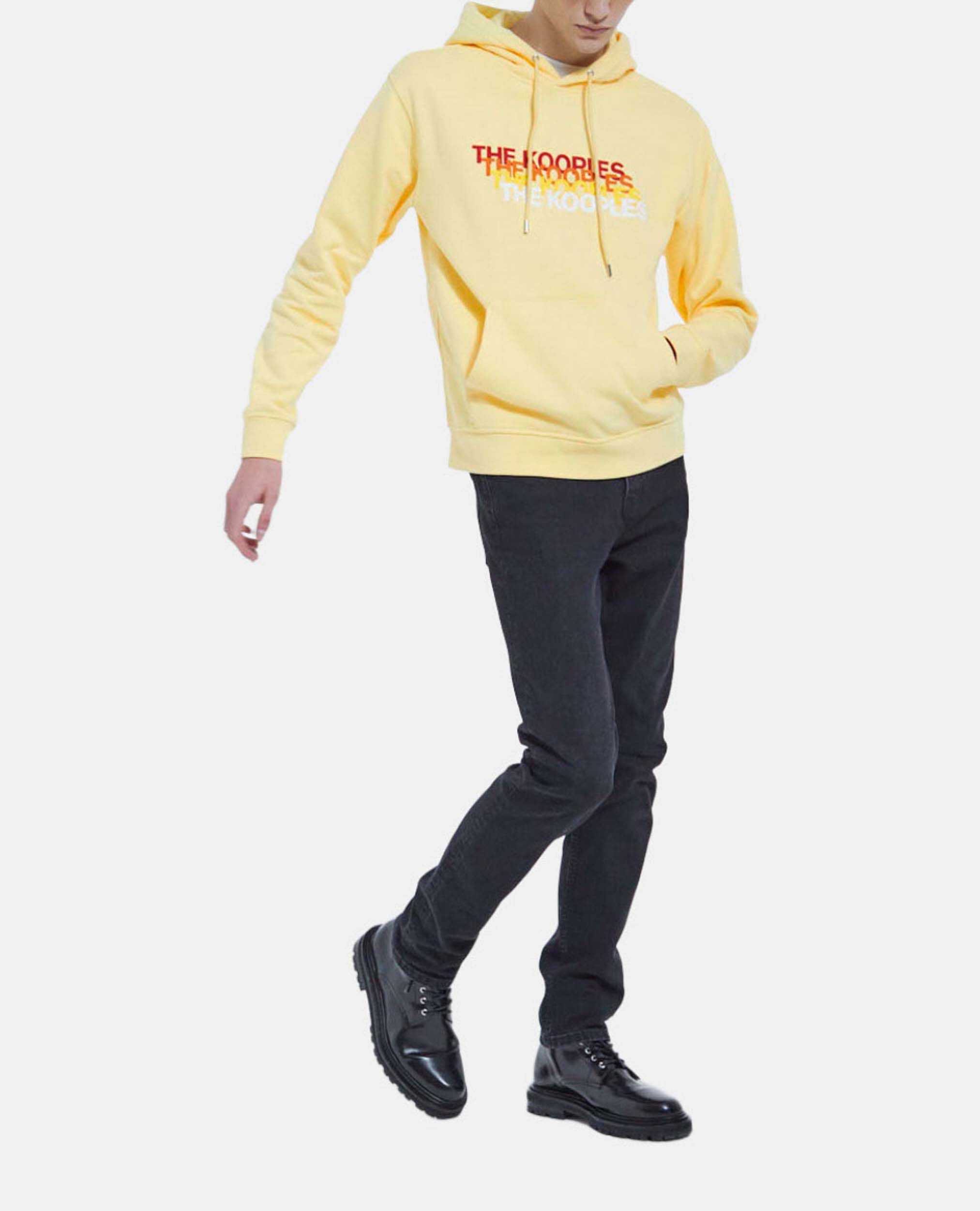 Yellow hoodie with black jeans 2025