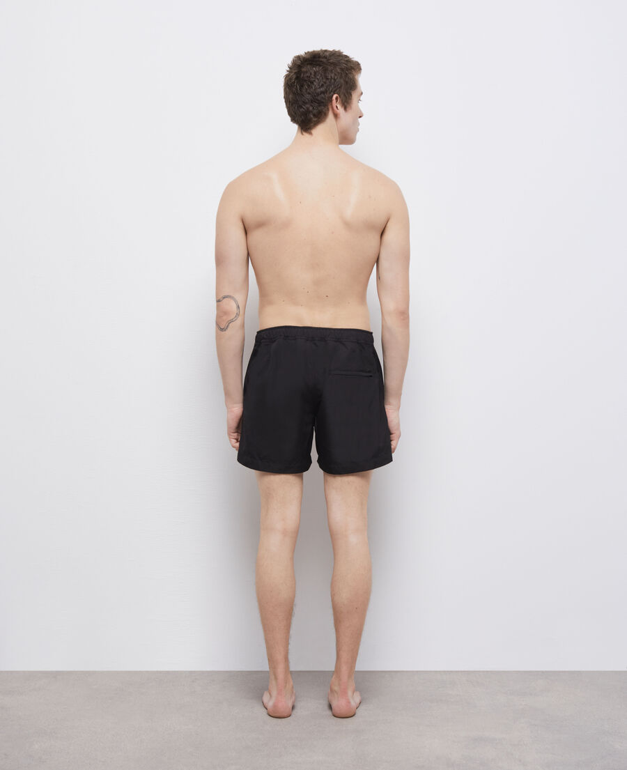 black swim shorts with logo