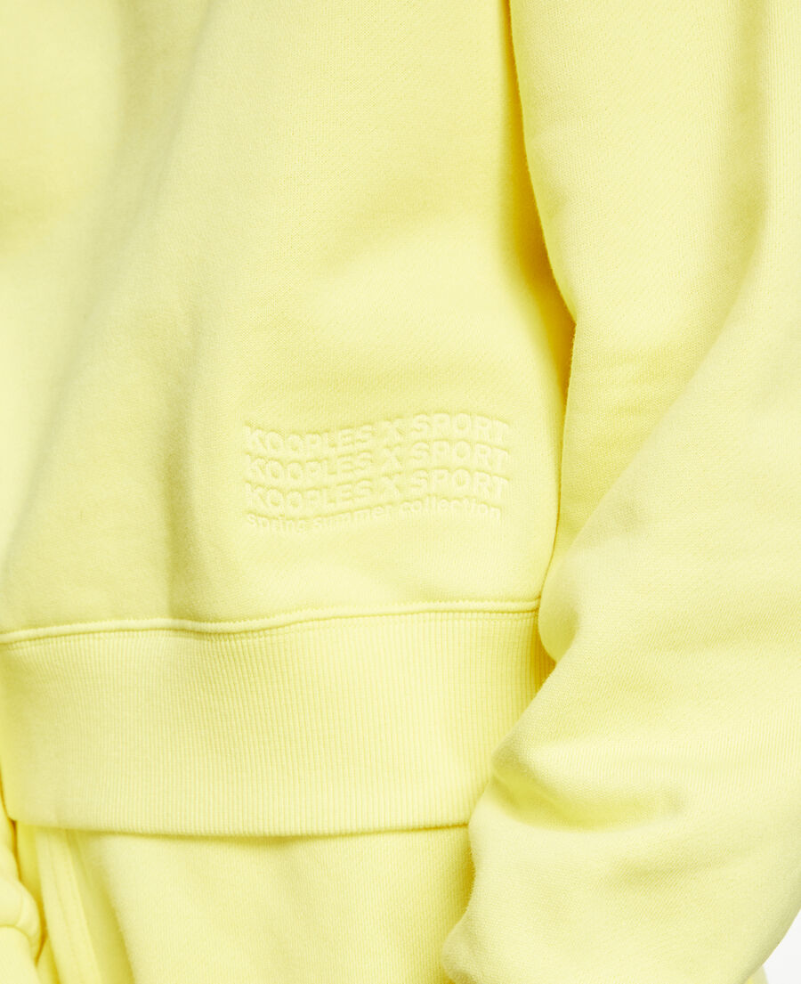 yellow sweatshirt with embossed logo