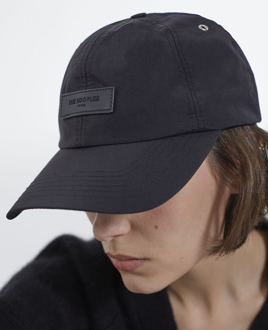 black nylon cap with matching leather badge