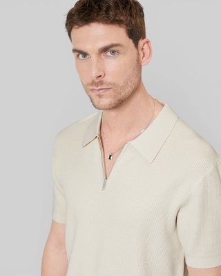 Jersey beige con cremallera y cuello de polo