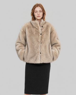Manteau en fausse fourrure reversible beige et noir